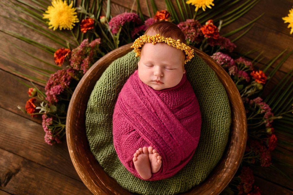 Close-up beautiful sleeping baby girl. Newborn baby girl, asleep on a blanket
